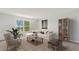 Inviting living room with a comfortable couch, a large window, and a bookshelf at 237 Kindness Cir, Mcdonough, GA 30252