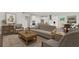 Open-concept living area with a modern kitchen, a dining space, and a comfortable seating area at 237 Kindness Cir, Mcdonough, GA 30252