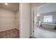 En-suite bathroom featuring a soaking tub and access to walk-in closet at 308 Moab Ct, Stockbridge, GA 30281