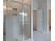 Modern tiled shower with glass door with tile flooring at 308 Moab Ct, Stockbridge, GA 30281