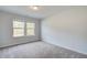 Comfortable bedroom with soft carpet and natural light from a large window at 308 Moab Ct, Stockbridge, GA 30281