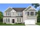 Charming two-story home featuring a brick facade, a two-car garage, and a well-maintained front yard at 308 Moab Ct, Stockbridge, GA 30281
