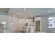 Open-concept kitchen with white cabinets, a center island, and stainless steel appliances at 308 Moab Ct, Stockbridge, GA 30281