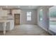 Bright and airy kitchen with white cabinets, stainless steel appliances, and access to the backyard at 308 Moab Ct, Stockbridge, GA 30281
