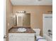Standard bathroom with a vanity, a mirror, and a bathtub/shower combination with white tile surround at 6404 Eastbriar Dr, Lithonia, GA 30058