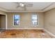 Bedroom featuring two windows and a closet at 6404 Eastbriar Dr, Lithonia, GA 30058