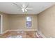 Bedroom featuring a window and ceiling fan at 6404 Eastbriar Dr, Lithonia, GA 30058