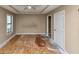 Bedroom featuring two windows, a door, and a closet at 6404 Eastbriar Dr, Lithonia, GA 30058