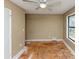 Bedroom featuring natural light from window with a ceiling fan and neutral paint at 6404 Eastbriar Dr, Lithonia, GA 30058