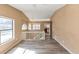 Bright interior featuring hardwood floors, large windows, and neutral walls at 6404 Eastbriar Dr, Lithonia, GA 30058
