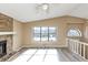 Sunlit living room with a stone fireplace and large windows at 6404 Eastbriar Dr, Lithonia, GA 30058