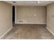 Room featuring neutral paint and trim with access to other rooms and crawl space at 6404 Eastbriar Dr, Lithonia, GA 30058
