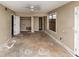 Room featuring neutral paint and trim with closet, window and access to other rooms at 6404 Eastbriar Dr, Lithonia, GA 30058