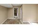 Room featuring neutral paint and trim with access to other rooms at 6404 Eastbriar Dr, Lithonia, GA 30058