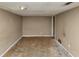 Room featuring neutral paint and trim with access to other rooms at 6404 Eastbriar Dr, Lithonia, GA 30058