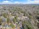 An aerial view of a neighborhood showing a skyline with a treelined view in a suburban area at 1038 Orlando Sw Pl, Atlanta, GA 30311