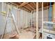 Unfinished basement framing shows potential bathroom with new tub and plumbing at 1038 Orlando Sw Pl, Atlanta, GA 30311
