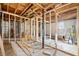 Basement showing framed walls and exposed ceiling with utilities, offering a spacious unfinished area at 1038 Orlando Sw Pl, Atlanta, GA 30311