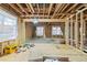 Exposed framing with an unfinished ceiling and walls showing new windows and ample space at 1038 Orlando Sw Pl, Atlanta, GA 30311