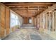 Interior framing with exposed beams and studs shows unfinished walls and floors and window installation at 1038 Orlando Sw Pl, Atlanta, GA 30311