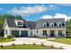 Stunning two-story home featuring a two-car garage, manicured lawn, and inviting front porch, perfect for suburban living at 221 Valley Ridge Dr, Carrollton, GA 30116