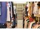 Walk-in closet with rods, shelves and drawers, and a variety of clothing neatly organized within at 3445 Stratford Ne Rd # 2305, Atlanta, GA 30326