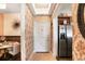 Hallway featuring wallpaper and access to the kitchen and dining area at 3445 Stratford Ne Rd # 2305, Atlanta, GA 30326