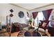 Inviting living room featuring a plush sofa, hardwood floors, and balcony access at 3445 Stratford Ne Rd # 2305, Atlanta, GA 30326