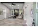 Inviting living room featuring a stone fireplace, wood-look floors, and a vaulted ceiling with an exposed beam at 4983 Needle Knob Ct, Lithonia, GA 30038