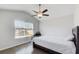 Bright bedroom with a vaulted ceiling, ceiling fan, and a window that allows for natural light at 12 Saint Georges Pl, Sharpsburg, GA 30277