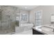 Spa-like bathroom featuring a soaking tub, walk-in shower, and elegant tile work at 1918 Coal Pl, Atlanta, GA 30318