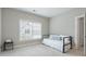 Neutral bedroom featuring daybed, natural light and neutral carpeted floors at 1918 Coal Pl, Atlanta, GA 30318