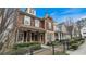 Street view showcasing craftsman-style home with inviting porch, landscaping, and neighborhood charm at 1918 Coal Pl, Atlanta, GA 30318