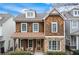 Charming craftsman-style home with cedar shake siding, stone accents, and inviting front porch at 1918 Coal Pl, Atlanta, GA 30318