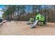 Community playground featuring slides and play equipment with wood chip ground covering at 1918 Coal Pl, Atlanta, GA 30318