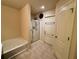 Bathroom featuring a bathtub, shower with glass door, and tile flooring at 6642 Story Circle Cir, Norcross, GA 30093