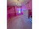 Pink-themed bedroom with a chandelier, chest of drawers and carpeted floor at 6642 Story Circle Cir, Norcross, GA 30093