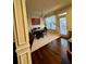 Cozy dining area with hardwood floors, natural light, and a modern light fixture at 6642 Story Circle Cir, Norcross, GA 30093