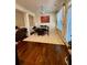 Dining area featuring hardwood floors and an elegant rug under the dining table at 6642 Story Circle Cir, Norcross, GA 30093