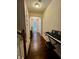 Hallway featuring hardwood flooring, a decorative chandelier, and a bright front door at 6642 Story Circle Cir, Norcross, GA 30093