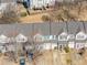 Aerial view of townhomes with well-maintained roofs, landscaping, and convenient parking at 820 Ash St, Canton, GA 30114