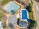 Aerial shot of community tennis courts and a covered pool alongside resident parking at 820 Ash St, Canton, GA 30114