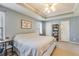 Bedroom features a large bed, neutral paint, and multiple closets at 820 Ash St, Canton, GA 30114