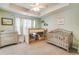 Bright and airy bedroom features neutral paint, natural light, and a tray ceiling at 820 Ash St, Canton, GA 30114