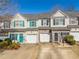 Charming townhome exterior with a private garage and manicured landscaping at 820 Ash St, Canton, GA 30114