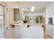 Cozy kitchen view of counterspace, stainless refrigerator, and exterior door at 820 Ash St, Canton, GA 30114