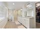 Bright bathroom with a glass shower, double sinks, and ample cabinet space for storage at 850 Moores Mill Nw Rd, Atlanta, GA 30327