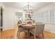 Beautiful dining room with hardwood floors, shutters, and a view into the living room at 850 Moores Mill Nw Rd, Atlanta, GA 30327