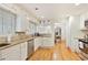 Bright kitchen with white cabinets, granite countertops, and stainless steel appliances at 850 Moores Mill Nw Rd, Atlanta, GA 30327