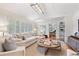 Cozy living room with a fireplace, plantation shutters and an open doorway to the dining room at 850 Moores Mill Nw Rd, Atlanta, GA 30327